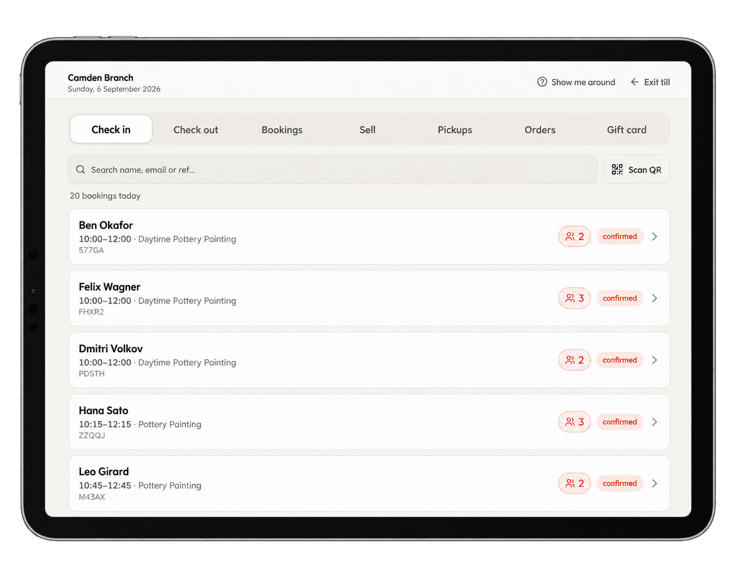 The till on the counter tablet: today's check-in list with party sizes, booking codes and the Scan QR button